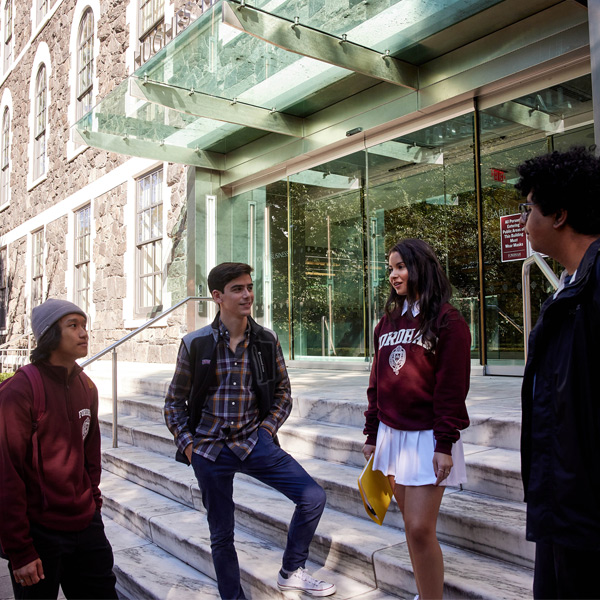 Students conversing outside of McShane Center on Rose Hill campus