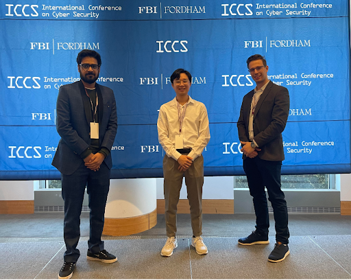 Three students attending the 2023 International Conference on Cyber Security Special Event