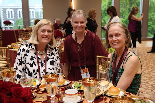 Three Fordham alumnae posing for a photo at a recent event
