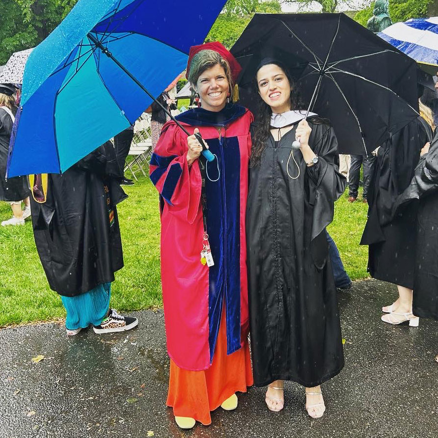 Nisa Khurram Hafeez and Dr. Annika Hinze at Commencement posing in the rain