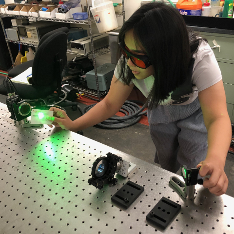 Jaeda aligning a laser in Dr. Holler's lab