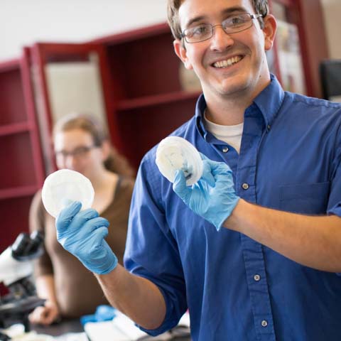 Male student with gloves and petri dish - LG