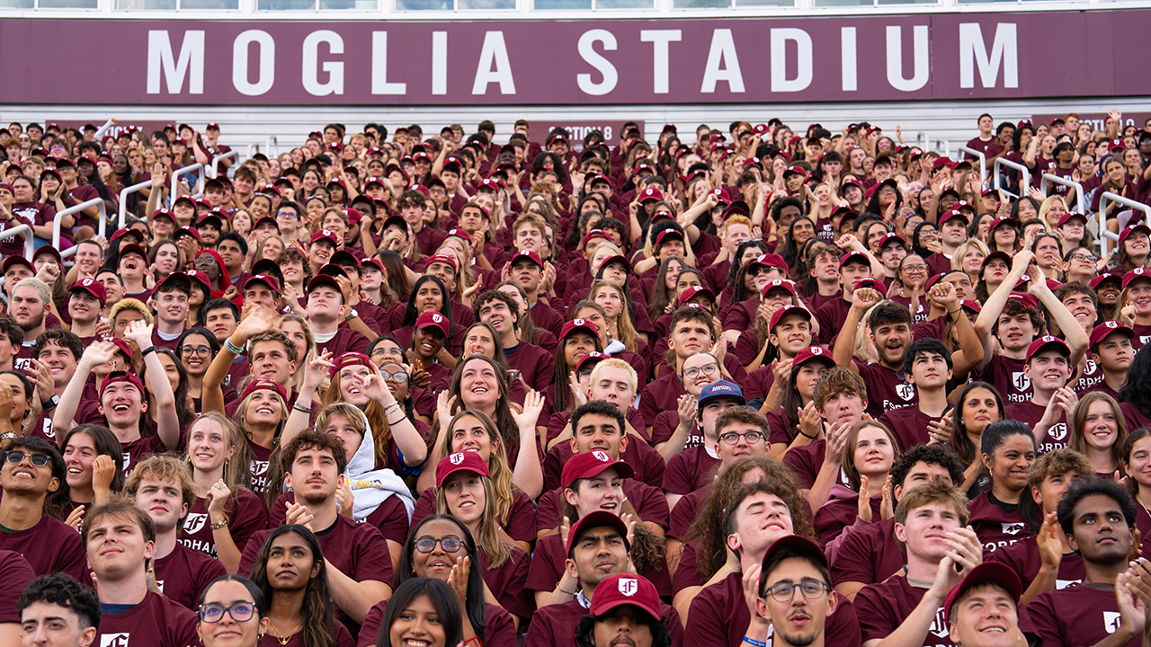 Students pose for the class photo at Moglia Stadium
