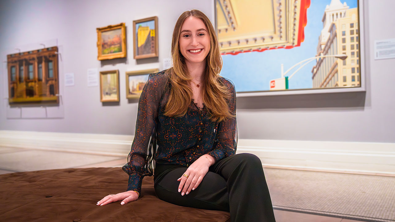 student posing inside museum