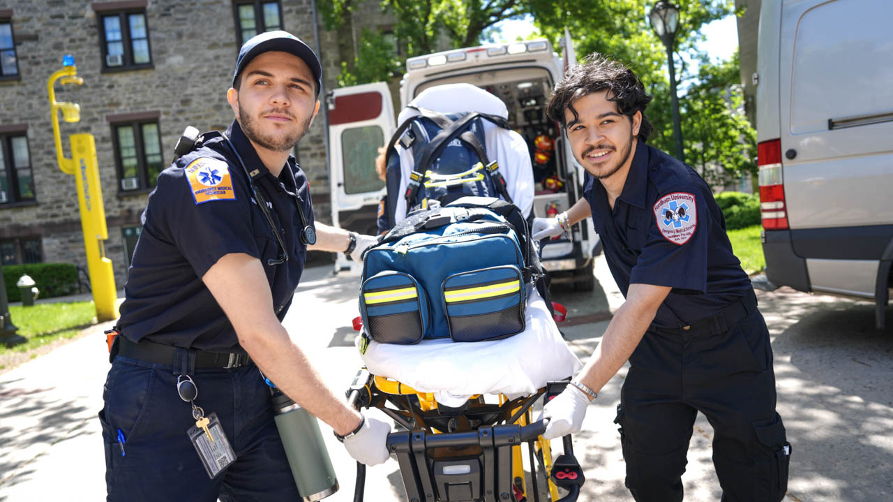 FUEMS students carry stretcher