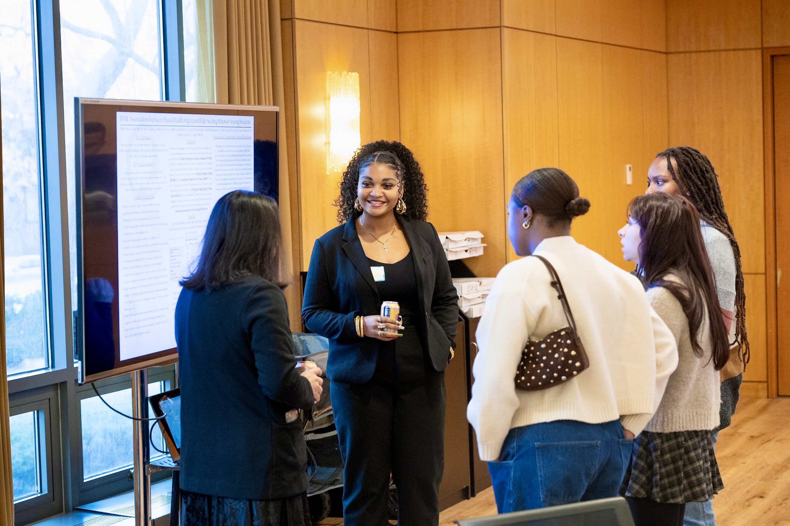 A Fordham student presents her research to the local community at YPAR showcase
