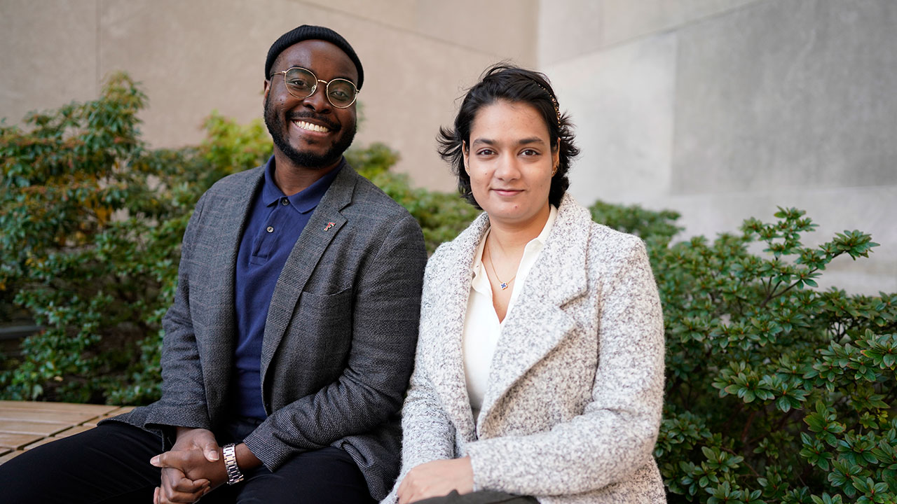 Two students seated next to each other