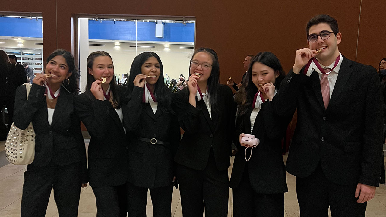 Students celebrate their success in the Gabelli School Consulting Cup
