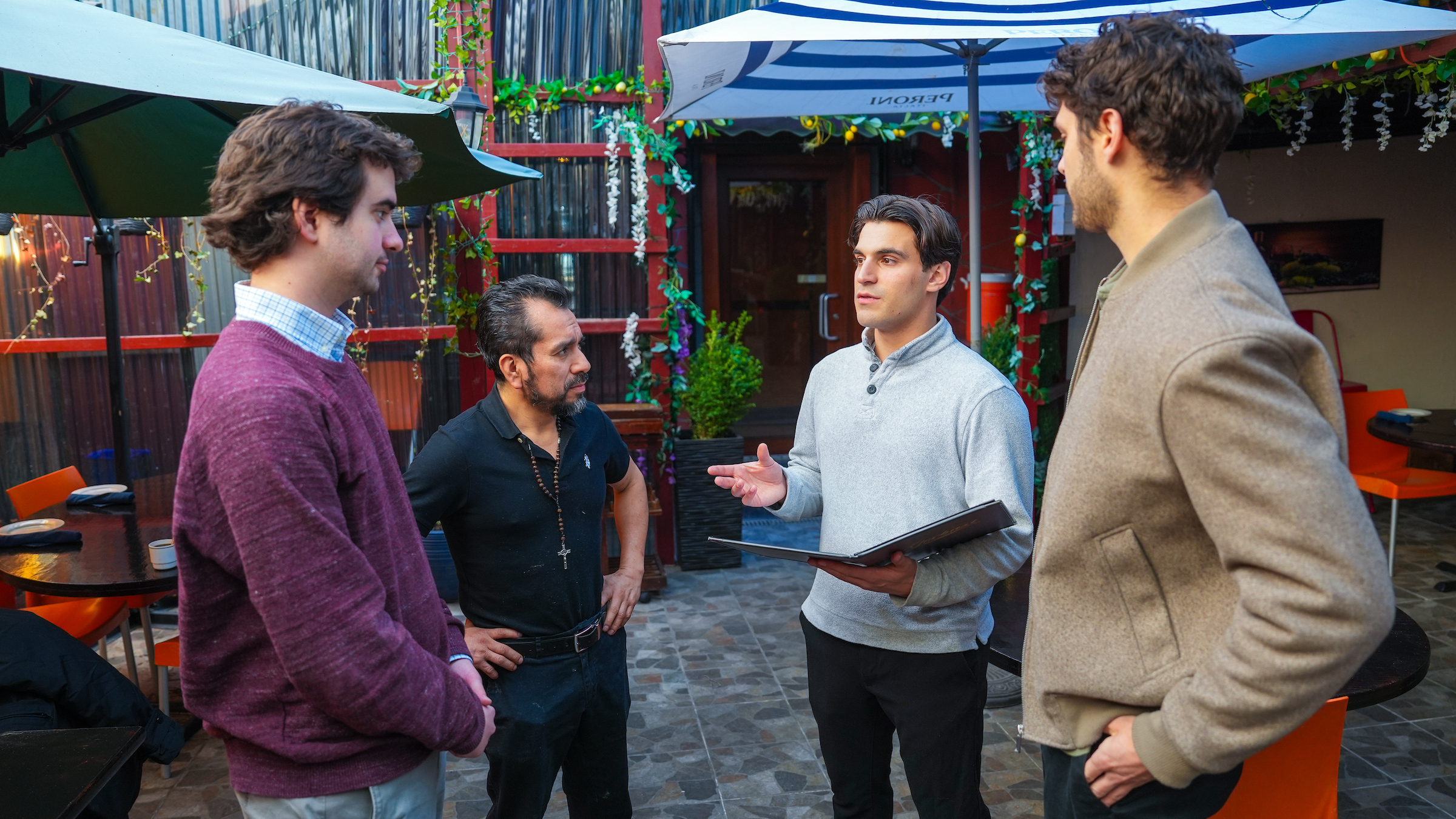 Students meet with restaurant owners at Moise's restaurant in the Bronx