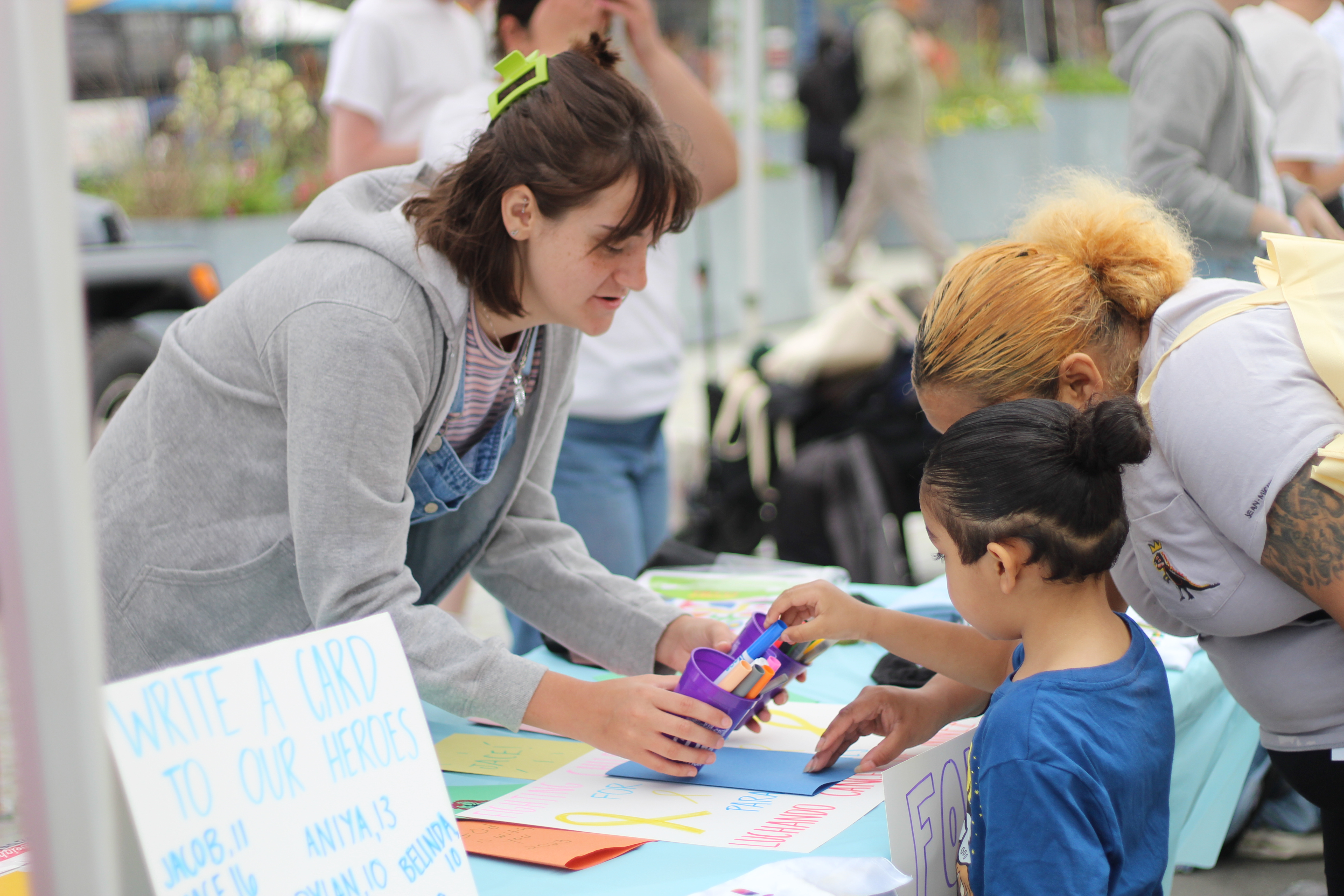 Pilar Valdes works with children at a Fordham community event