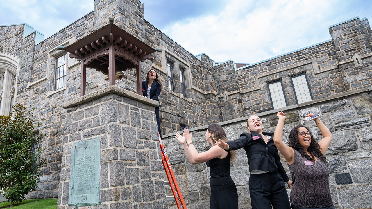 Fordham students ring the victory bell on opening day