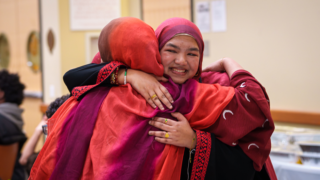Two students embracing