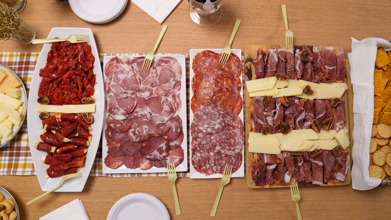 A spread of meat and cheese dishes