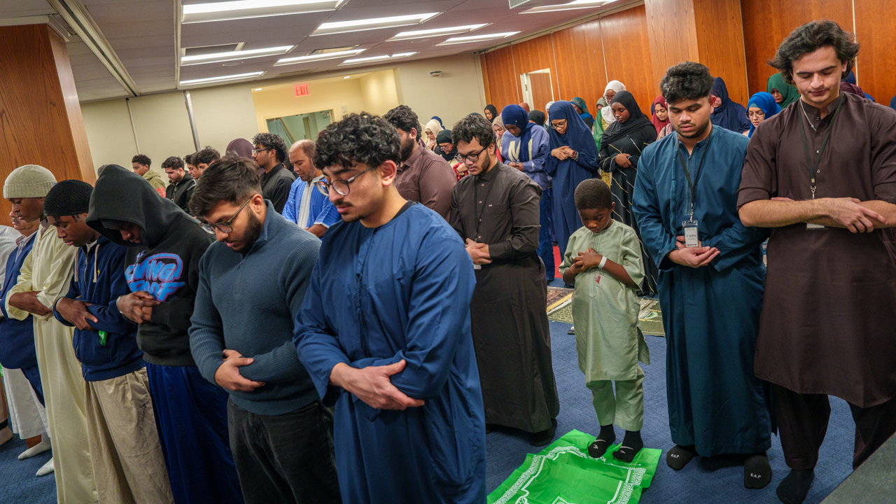The Muslim community prays together.