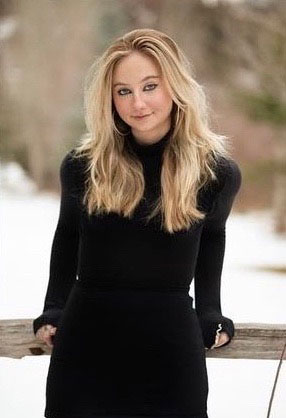 A student poses outside