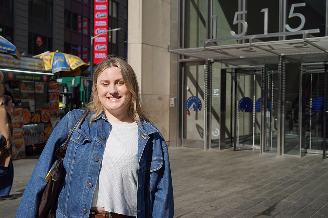 A student poses outside of Paramount