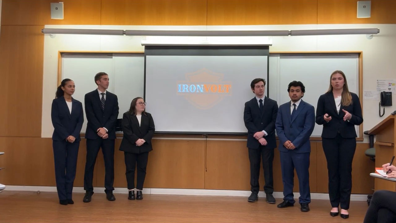 A group of students practices its presentation