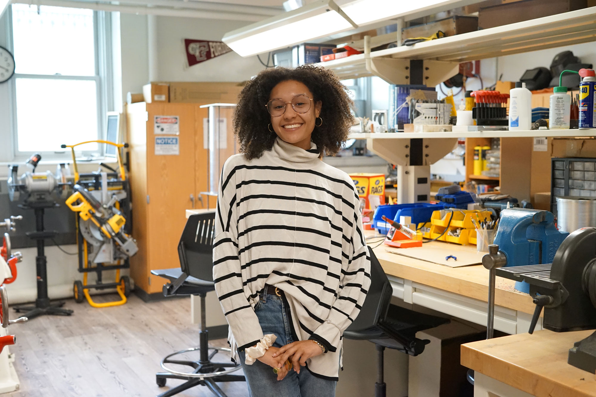 A student smiles in a lab