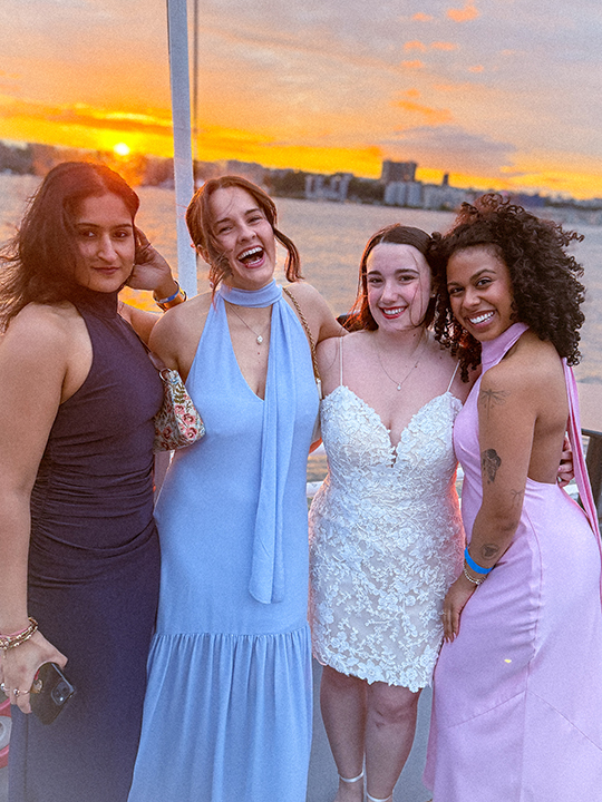 Students pose for a photo on the cruise