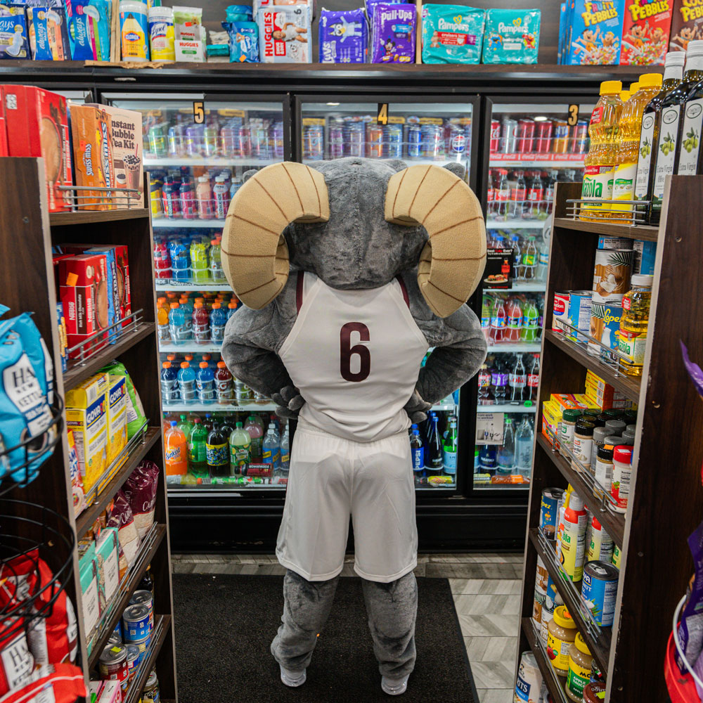 Ramses looks at the selection of sodas at his local bodega