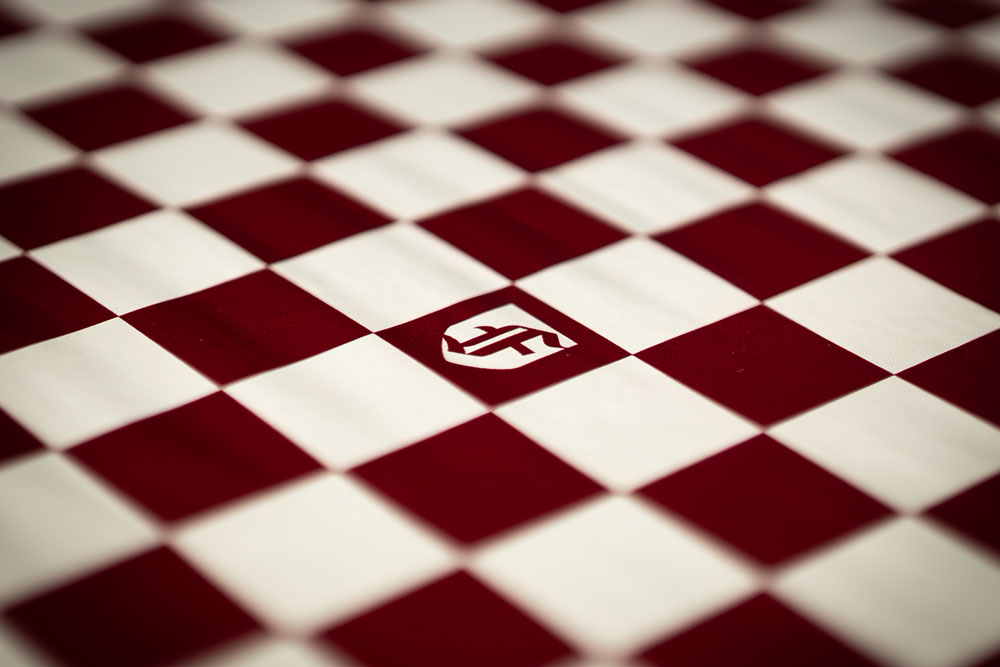 Checkered tablecloth with the Fordham logo