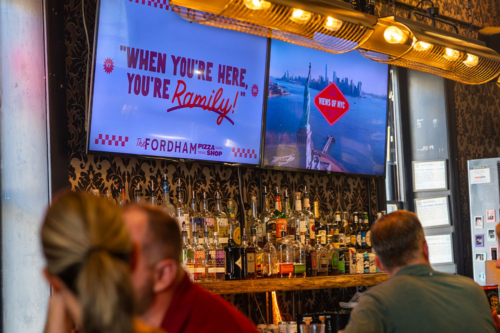 Digital screens inside the Fordham Pizza Shop at the NACAC Conference in Columbus Ohio