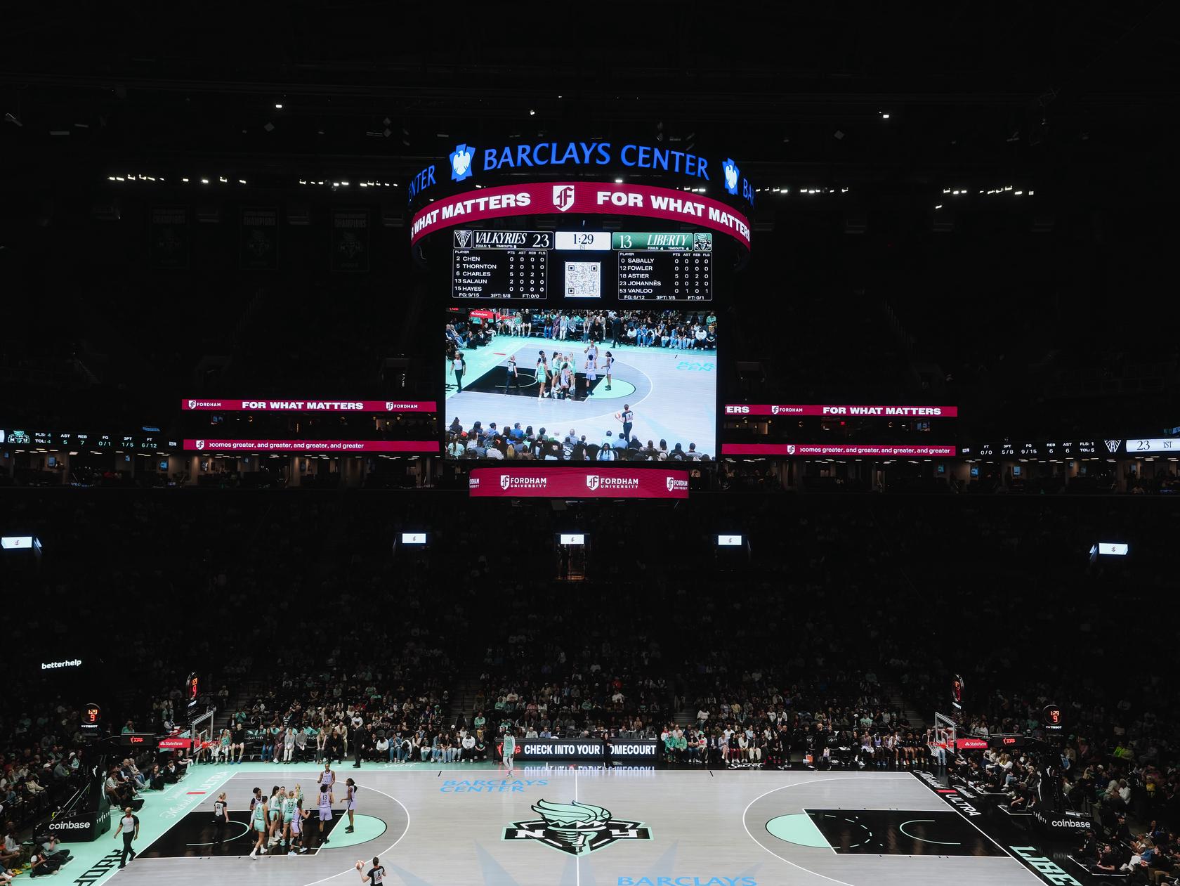 The Fordham logo displayed at the Barclays Center on the NY Liberty court