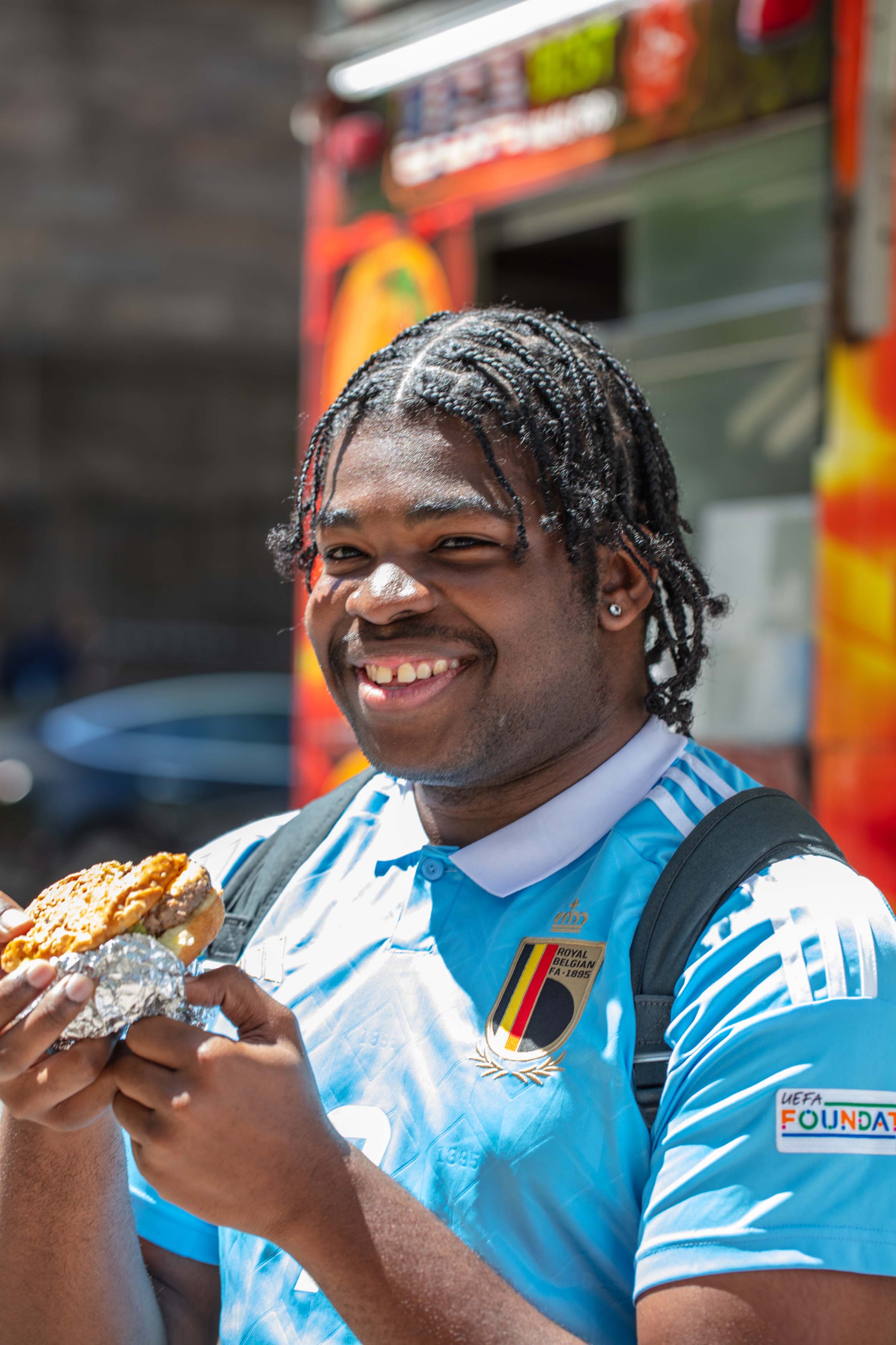 student eating at vendor truck in NYC