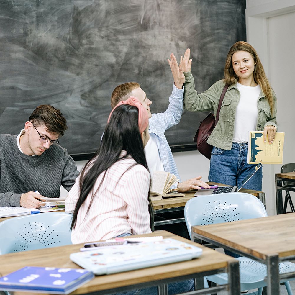 Teacher giving high five to student