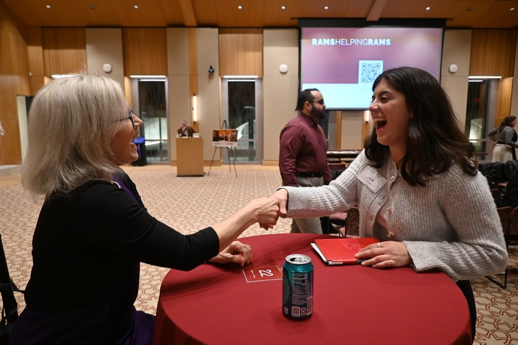 Two Fordham alumnae connecting at a career networking event