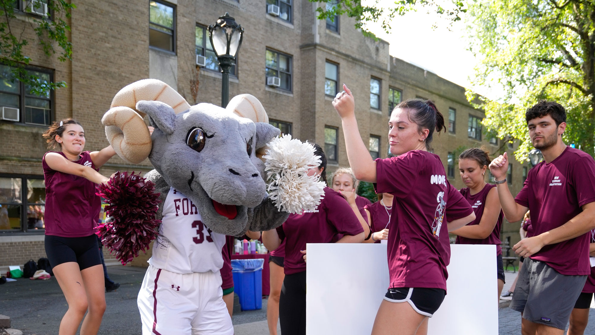 Ramses dances with students at Opening Day