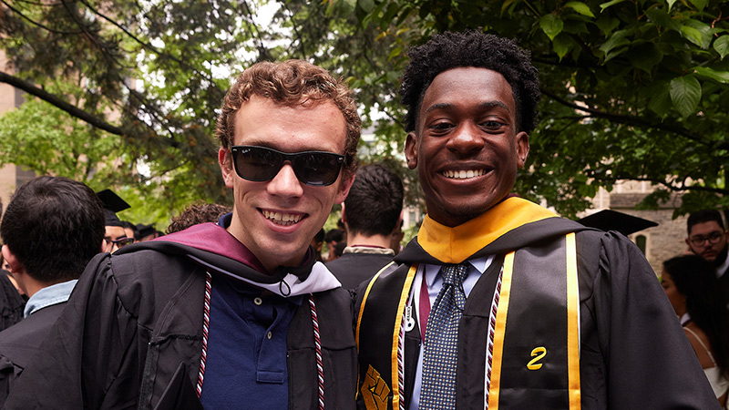 2 male grads at Commencement 2022