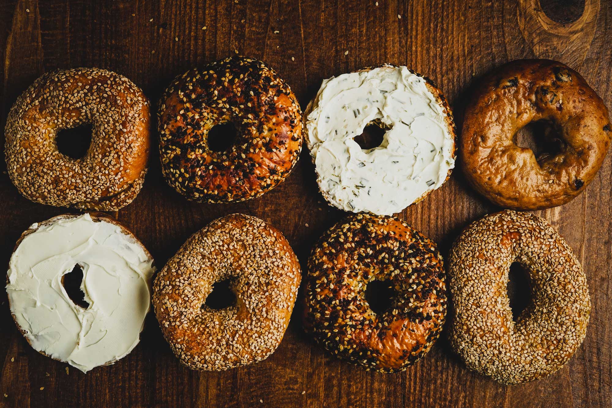 Assortment of bagels, some with cream cheese