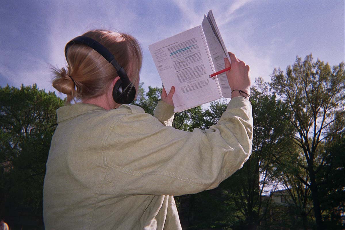 Student reading outside