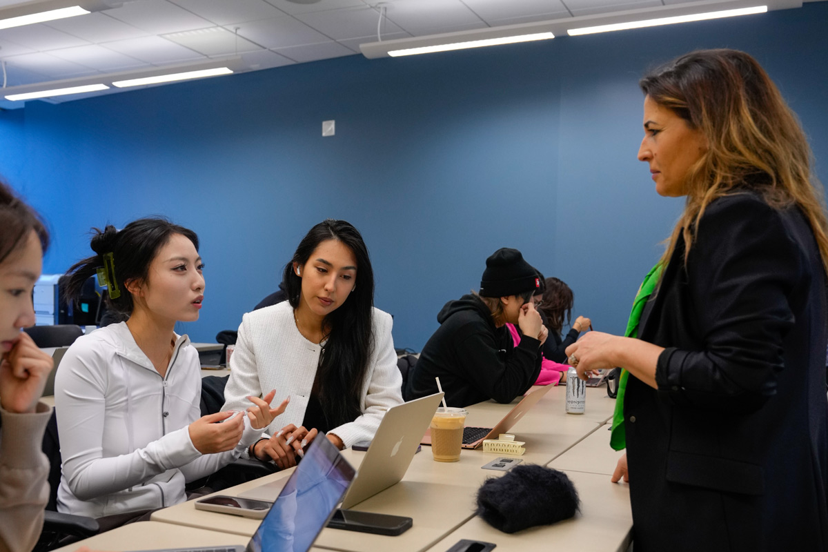 Students in discussion with an accounting professor