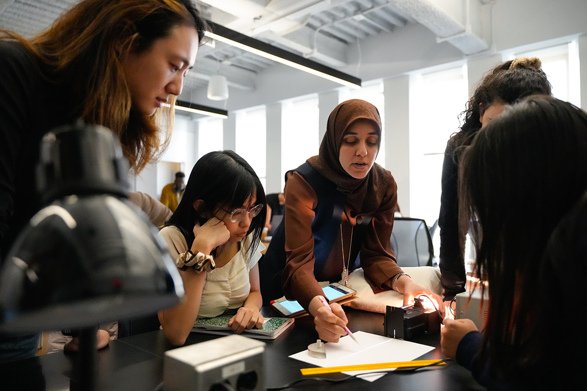 A group of students collaborting on a group project