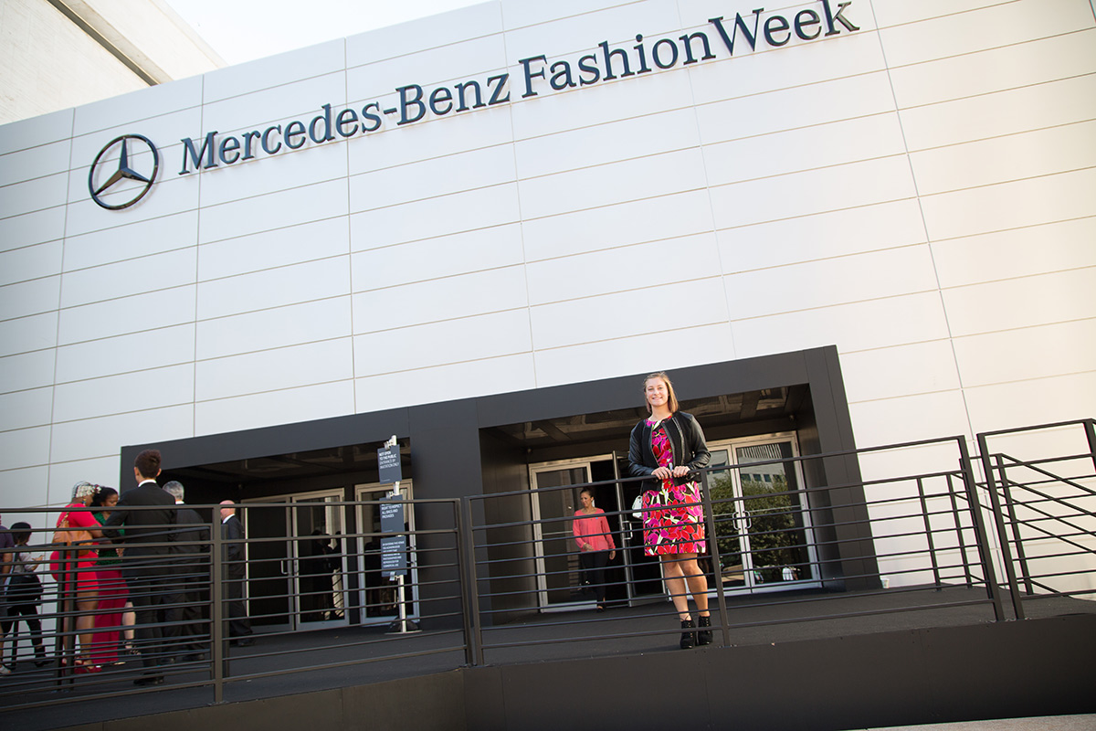 A student attends a Mercedes Benz fashion week event