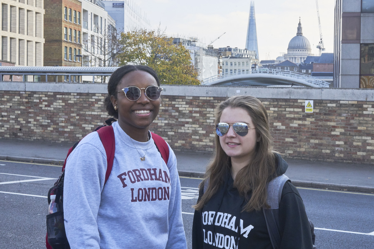 Two female students in London wearing Fordham London sweatshirts