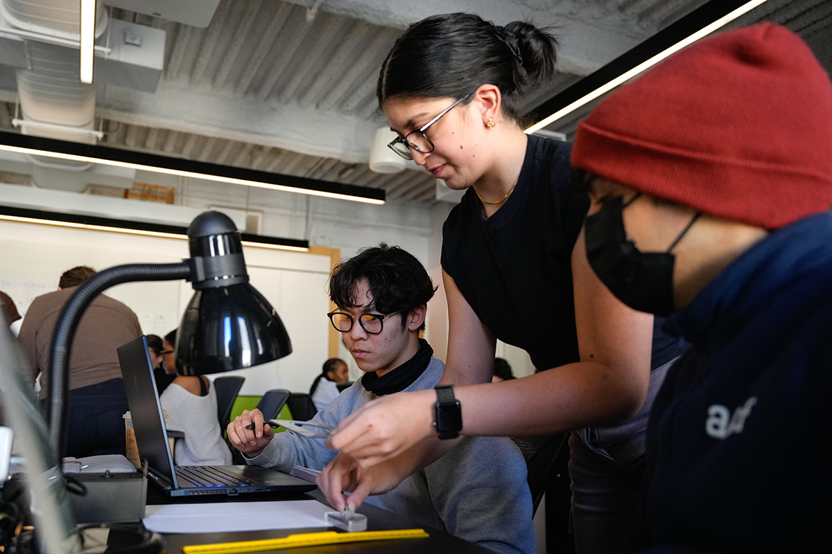 A group of students working together in a lab setting