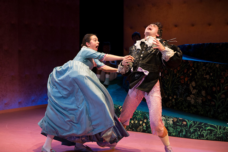 Two female students performing a scene on stage