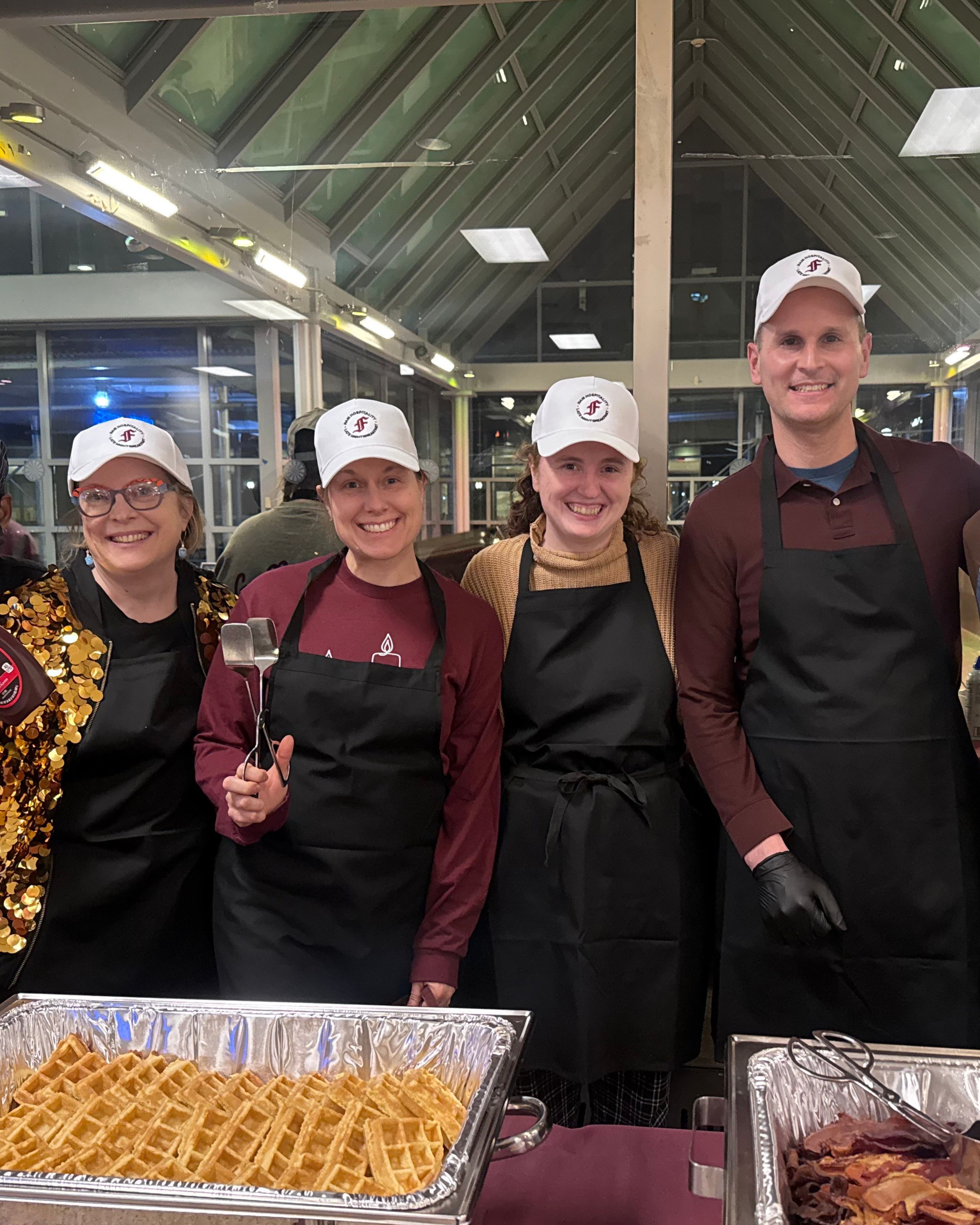 Campus Ministers serve food at Fordham Lincoln Center event.