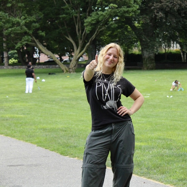 student outside thumbs up