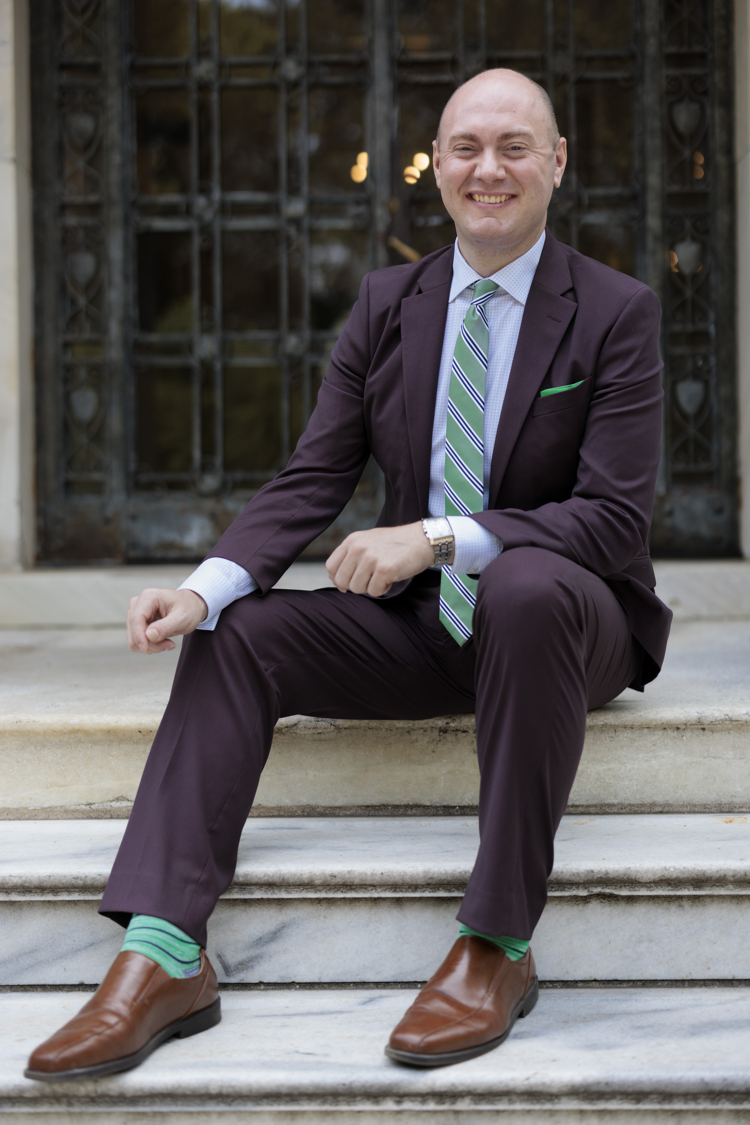 VP of External Affairs Travis Proulx sitting in front of Cunniffe House- Rose Hill
