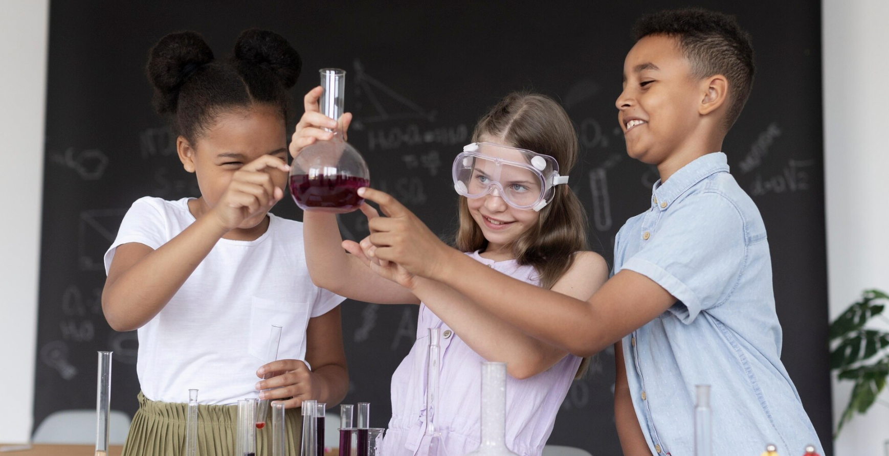 Stock Image of Kids in a lab with a beeker
