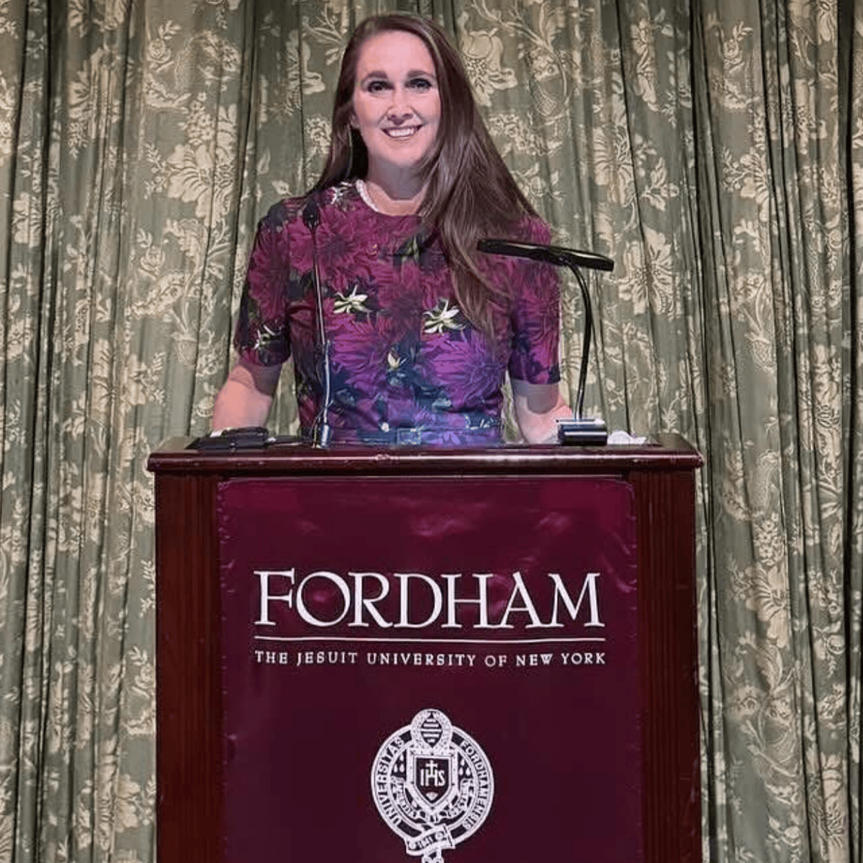 Lori Cruz Doty standing at a podium