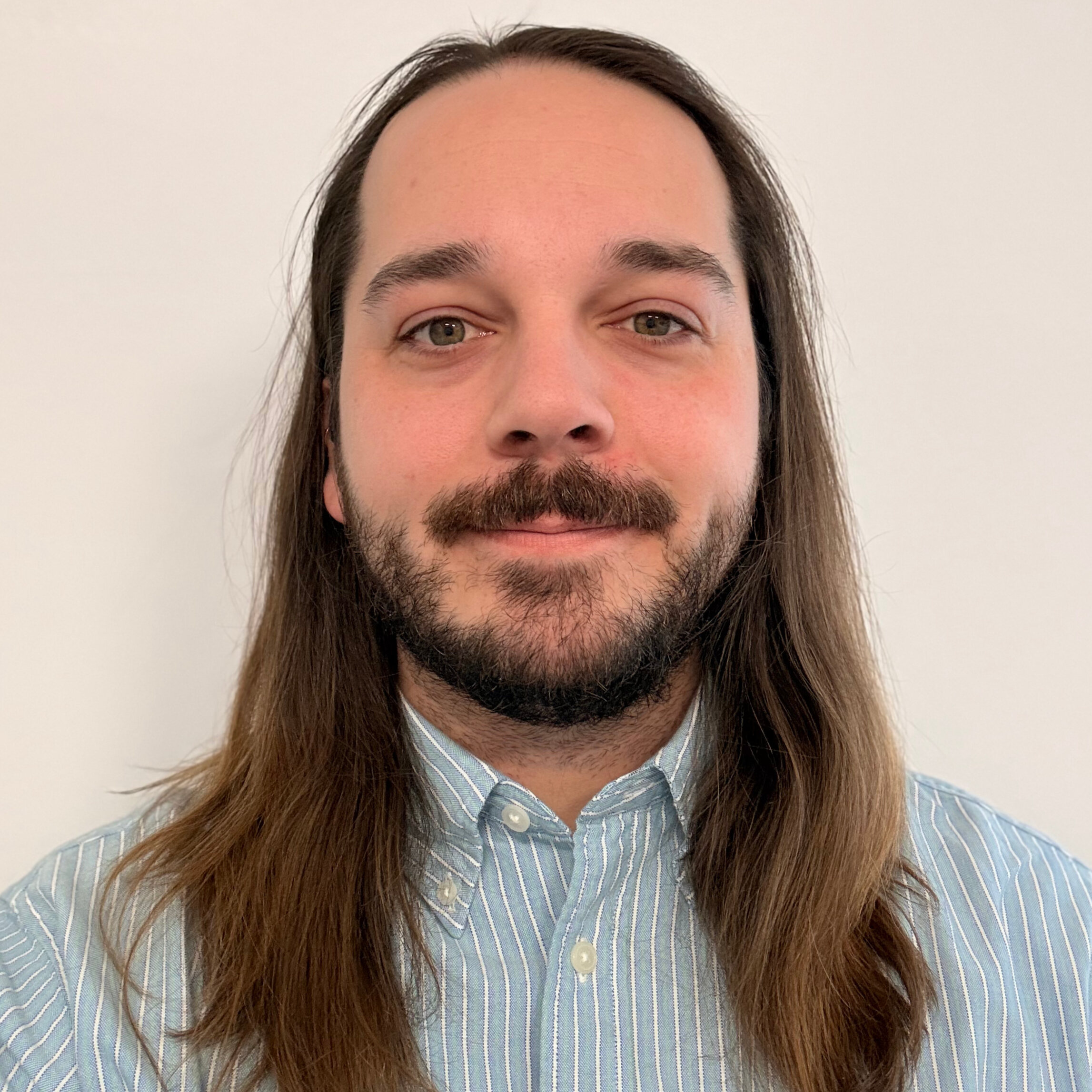 Nathan Faust smiling for a portrait
