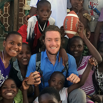 IPD Travel student abroad with local children and community members