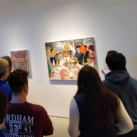 Jewish Studies students examine a painting in a museum