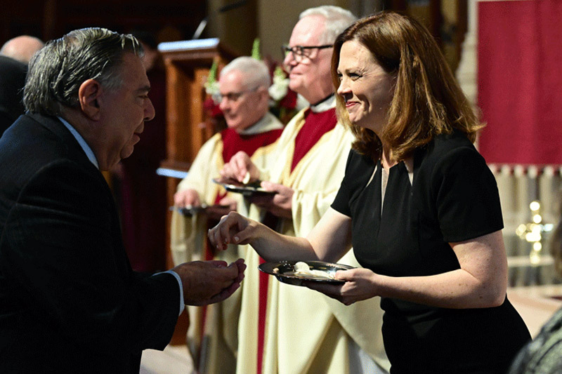 President Tetlow gives communion at her Missioning Mass