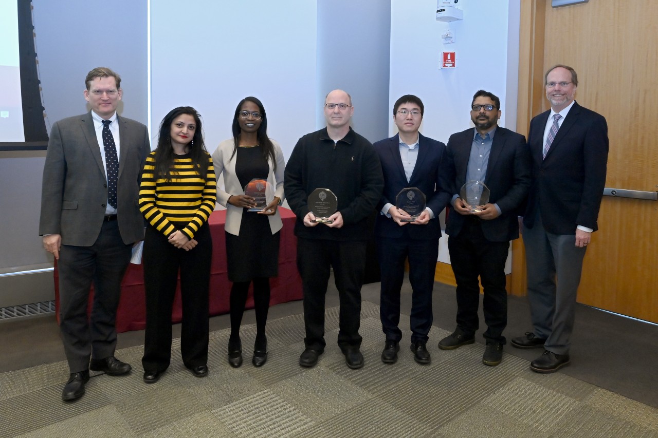 Group photo of Jonathan Crystal, Ipsita Banerjee, Atinuke Adediran, Benjamin Segal for Grace Lee, Juntao Chen, Asif Siddiqi, Dennis Jacobs.